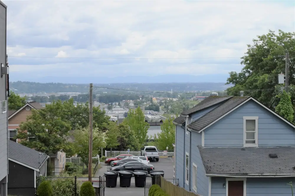 Hillside Tacoma neighborhood of houses with a view toward the water
