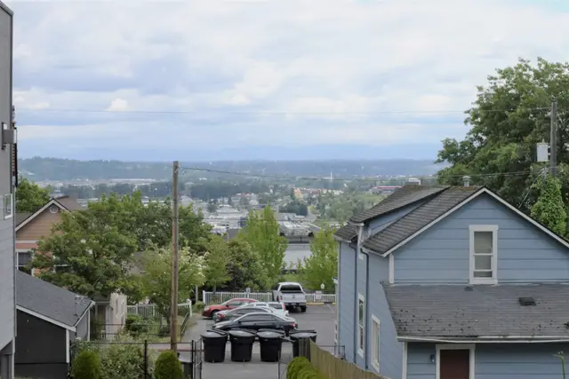 Hillside Tacoma neighborhood of houses with a view toward the water