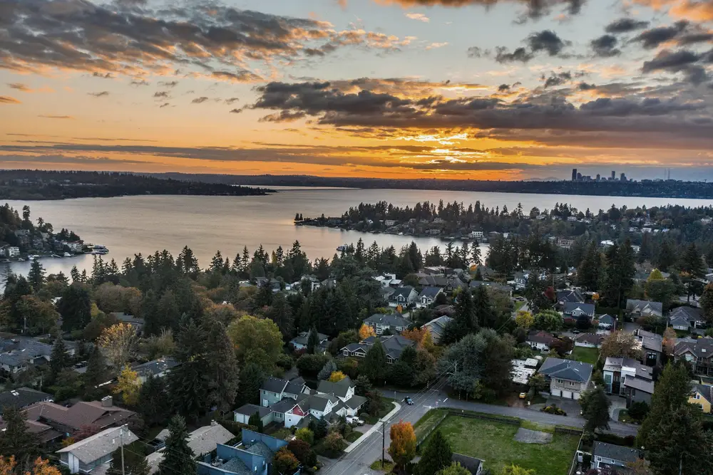 Aerial view of a waterfront neighbourhood at sunset